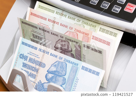 Zimbabwean dollar in the counting machine 119421527