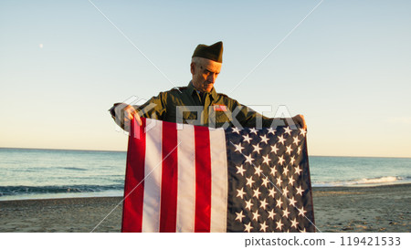 Veteran Soldier Taking Care Of The Usa Flag And Folding It  119421533