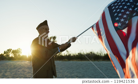 Old Soldier Happily Waving The USA Flag  119421536