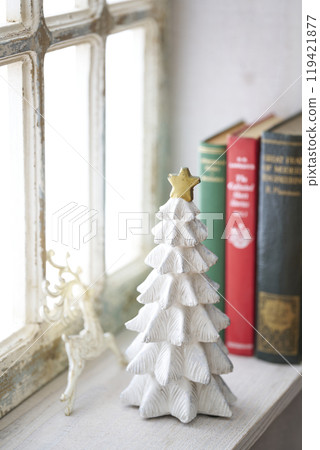 Christmas tree on an antique windowsill 119421877