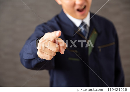 A middle-aged male businessman in work clothes who is bullying someone A middle-aged male businessman in work clothes who is bullying someone 119421916