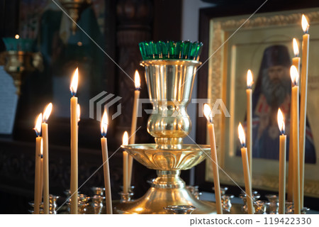 Burning Candles in a Lampada in an Orthodox Church 119422330