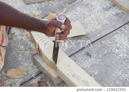 Wooden worker with equipment on farm 119422501