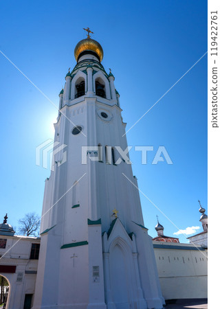 Bell tower of the Vologda Kremlin. A majestic structure with a golden dome against the blue sky. 119422761