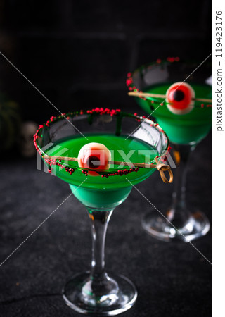 Spooky green Halloween cocktail with eyeball Spooky green Halloween cocktail with eyeball 119423176
