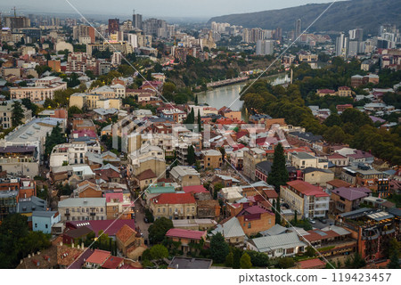 A breathtaking aerial view of Tbilisi showcasing vibrant architecture and dynamic river life 119423457