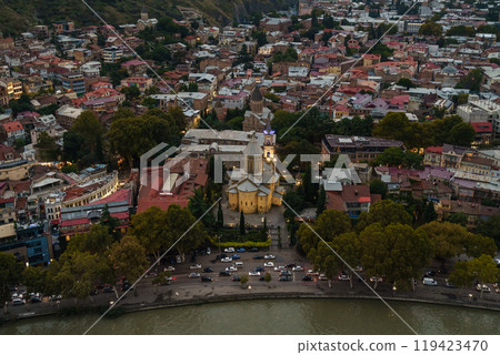 Aerial view of vibrant neighborhoods and historic architecture at dusk 119423470