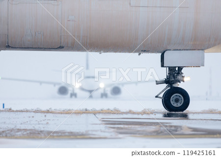 Aircraft fuselage covered with deicing fluid at airport 119425161