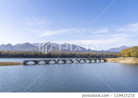 Taushubetsu River Bridge on the former Shihoro Line of the Japanese National Railways on a clear autumn day in Kamishihoro, Hokkaido Taushubetsu River Bridge on the former Shihoro Line of the Japanese National Railways on a clear autumn day in Kamishihoro, Hokkaido 119425210