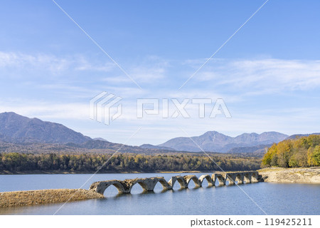 Taushubetsu River Bridge on the former Shihoro Line of the Japanese National Railways on a clear autumn day in Kamishihoro, Hokkaido 119425211
