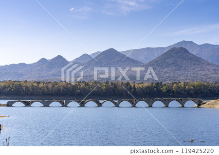 Taushubetsu River Bridge on the former Shihoro Line of the Japanese National Railways on a clear autumn day in Kamishihoro, Hokkaido Taushubetsu River Bridge on the former Shihoro Line of the Japanese National Railways on a clear autumn day in Kamishihoro, Hokkaido 119425220