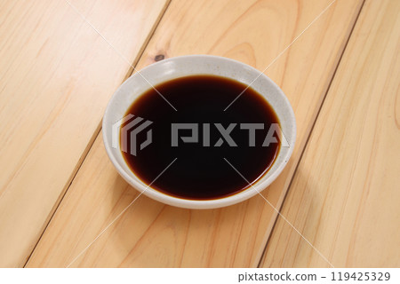 Soy sauce poured in dish Soy sauce poured in dish 119425329