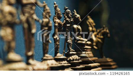 Row Of Old Ancient Bronze Figurines Of Indian Deities And Avatars. 18-19th Century Ce. Close-up View On Vamana Avatara Row Of Old Ancient Bronze Figurines Of Indian Deities And Avatars. 18-19th Century Ce. Close-up View On Vamana Avatara 119426165