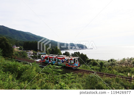 A train running near Yoshihama Station on the Sanriku Railway Minami-Rias Line A train running near Yoshihama Station on the Sanriku Railway Minami-Rias Line 119426977