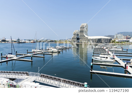 View of Yacht Marina at Glory Pier of Kaohsiung Port, Taiwan. with the Kaohsiung Music Center building. 119427190