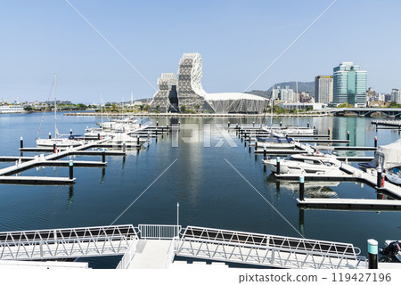 View of Yacht Marina at Glory Pier of Kaohsiung Port, Taiwan. with the Kaohsiung Music Center building. 119427196