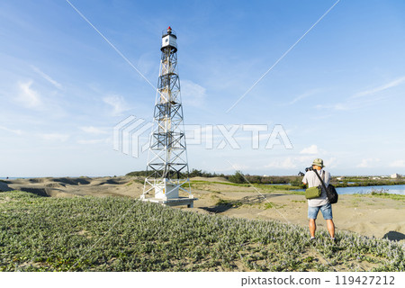Building view of the Guosheng Lighthouse in Qigu, Tainan, Taiwan. The westernmost point of Taiwan and Taijiang National Park Attractions. 119427212