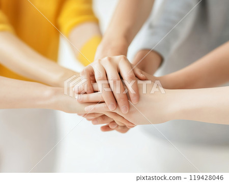 A group of people from different nationalities holding hands A group of people from different nationalities holding hands 119428046