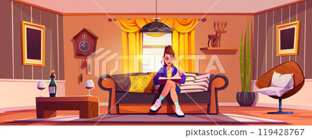 Young woman on couch reads book in living room Young woman on couch reads book in living room 119428767