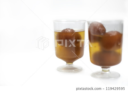 Indian dessert Gulab Jamun in transparent glass bowls. 119429595