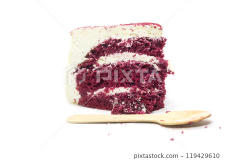 Slice of delicious red velvet cake with wooden spoon on white background Slice of delicious red velvet cake with wooden spoon on white background 119429610