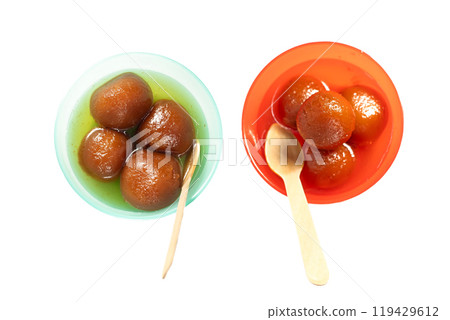 Top view of colorful bowls of Gulab Jamun with Spoon. Traditional Indian sweets on white background Top view of colorful bowls of Gulab Jamun with Spoon. Traditional Indian sweets on white background 119429612