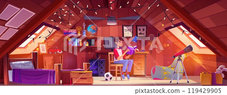 Teen boy reading book in attic bedroom 119429905