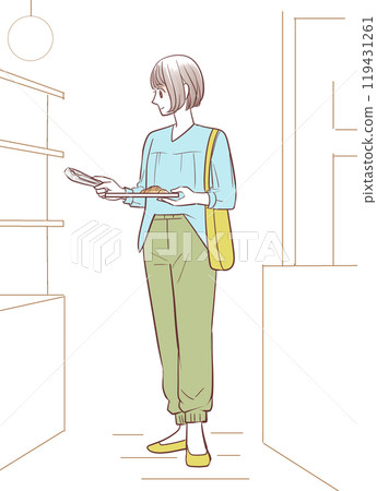 Female customer holding tongs at a bakery Female customer holding tongs at a bakery 119431261