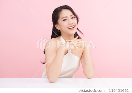Beautiful young asian woman with clean fresh skin on pink background, Face care, Facial treatment, Cosmetology, beauty and spa, Asian women portrait. Beautiful young asian woman with clean fresh skin on pink background, Face care, Facial treatment, Cosmetology, beauty and spa, Asian women portrait. 119431661