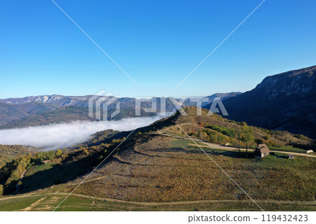 Aerial view of autumn morning mist and clouds in the valley Aerial view of autumn morning mist and clouds in the valley 119432423