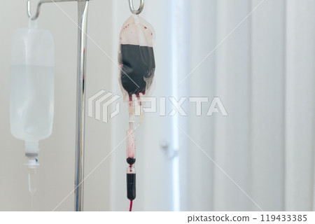 Blood transfusion on stand in the hospital room. 119433385