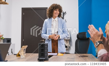 Happy businesswoman giving presentation in conference room at office 119433405