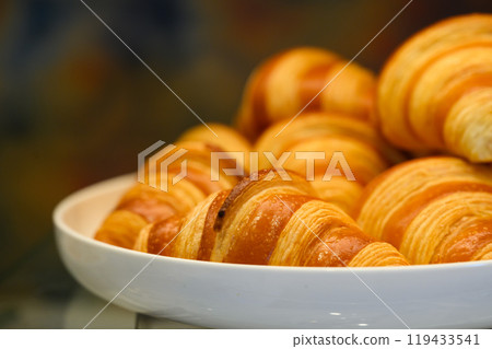 Homemade mini croissants on white plate in buffet line. Fresh Baked Buttery Croissants. Homemade mini croissants on white plate in buffet line. Fresh Baked Buttery Croissants. 119433541