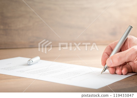 Close up Businessman Signing a Contract Document 119433847