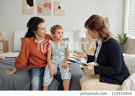 Social Worker Working With Adoptive Family At Home Social Worker Working With Adoptive Family At Home 119433928