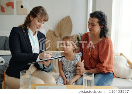 Social Worker Visiting To Adoptive Family At Home Social Worker Visiting To Adoptive Family At Home 119433937