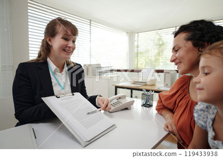Family Discussing Agreement With Social Worker Family Discussing Agreement With Social Worker 119433938