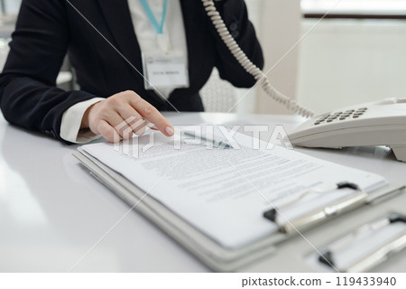 Social Worker Discussing Document By The Phone Social Worker Discussing Document By The Phone 119433940