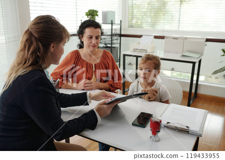 Social Worker Explaining Adoption Agreement 119433955