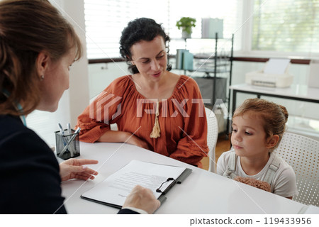 Woman Signing Document About Adoption 119433956