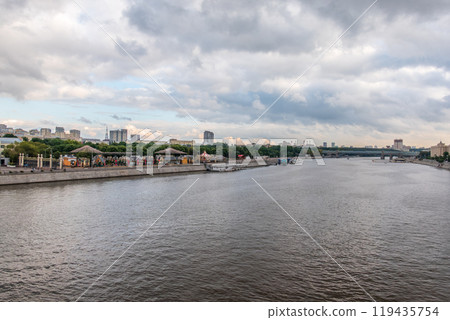 View of the Moscow river embakment, Pushkinsky bridge and cruise ships at sunset. View of the Moscow river embakment, Pushkinsky bridge and cruise ships at sunset. 119435754