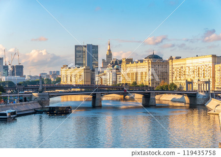 Panoramic view Borodinsky bridge, river Moscow, old buildings and high towers. View of the Borodinsky Bridge and the embankment in Moscow Panoramic view Borodinsky bridge, river Moscow, old buildings and high towers. View of the Borodinsky Bridge and the embankment in Moscow 119435758