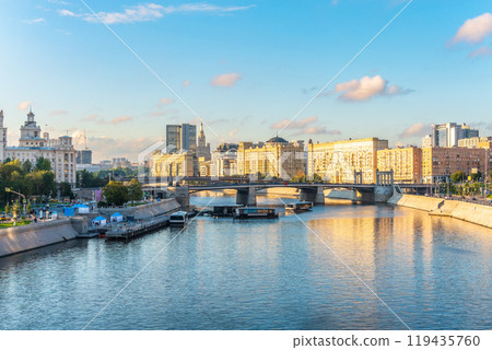 Panoramic view Borodinsky bridge, river Moscow, old buildings and high towers. View of the Borodinsky Bridge and the embankment in Moscow Panoramic view Borodinsky bridge, river Moscow, old buildings and high towers. View of the Borodinsky Bridge and the embankment in Moscow 119435760