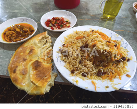 Kabuli pulao, pilaf the national dish of Afghanistan. Restaurant in Kunduz. Kabuli pulao, pilaf the national dish of Afghanistan. Restaurant in Kunduz. 119435855