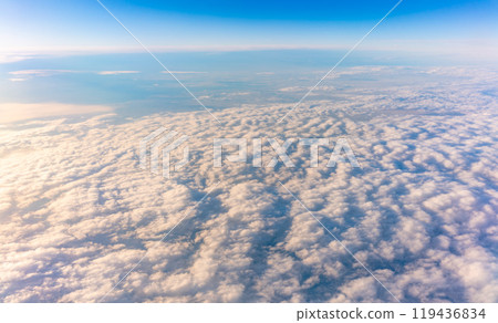 Beautiful orange and pink sunrise over the clouds, view from the plane. 119436834
