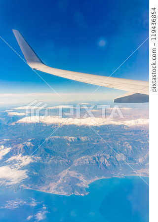View from the airplane window of the mountains and sea resort with corals in Egypt, Sharm El Sheikh.Flight 119436854