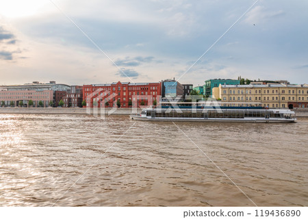 Cruise ship sails on the Moscow river in Moscow city center, popular place for walking. 119436890
