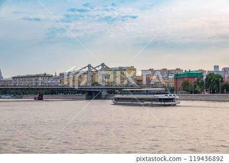 Cruise ship sails on the Moscow river in Moscow city center, popular place for walking. 119436892