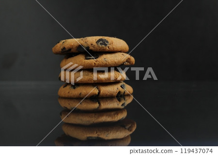 cookies with chocolate chips on a black background with space for text. Chocolate Chip Cookie Stack cookies with chocolate chips on a black background with space for text. Chocolate Chip Cookie Stack 119437074