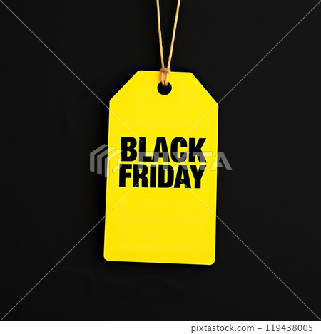 Yellow paper Black Friday label in black background . Copy space 119438005